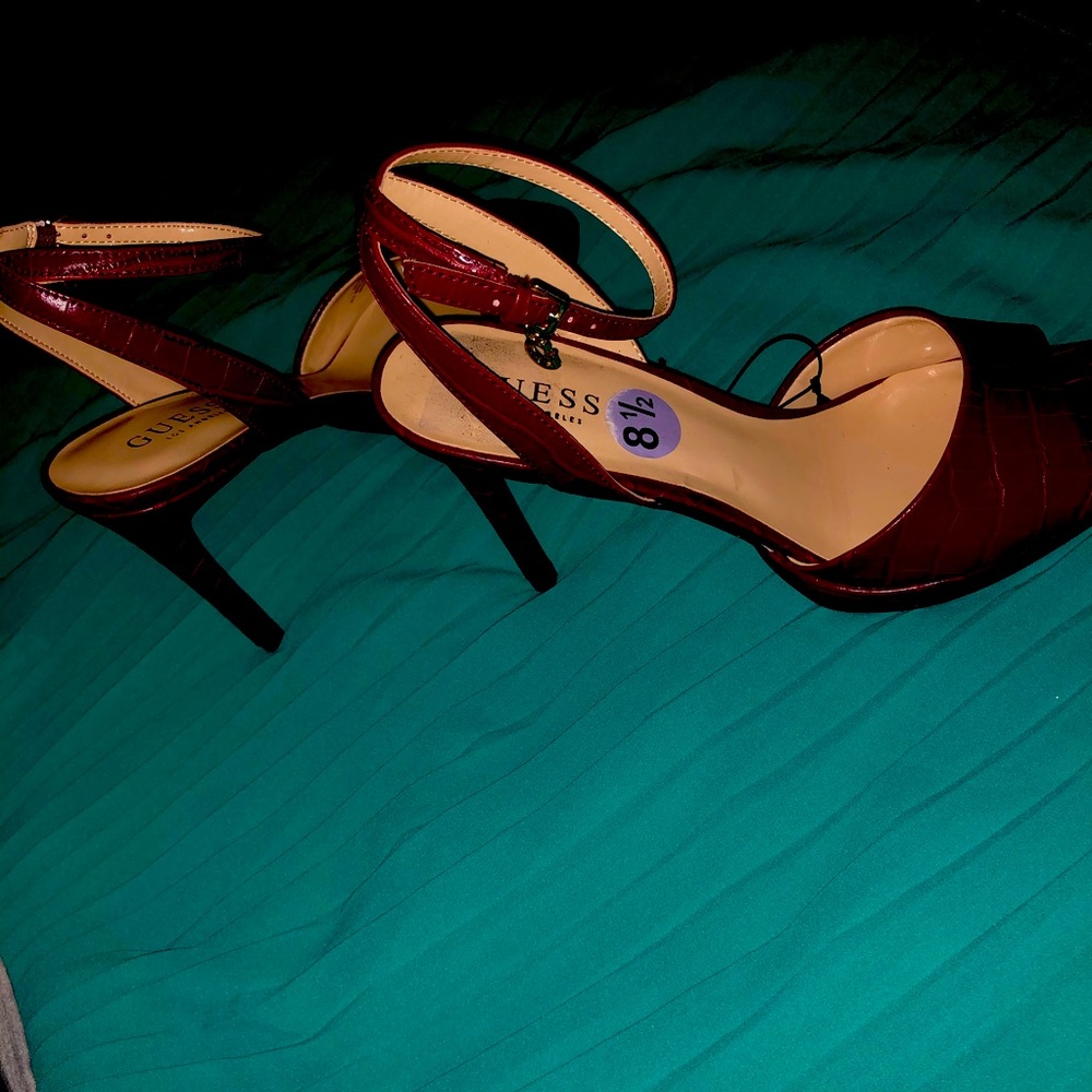 Peep open toe ankle strap high heel sandals.